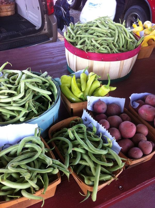 Farmers Market vegetables in trays and buckets