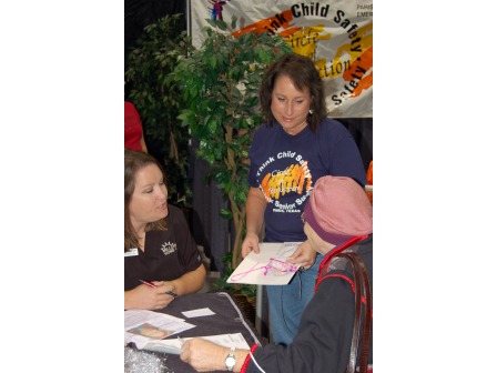 People Helping out at a Think Child Safety Expo