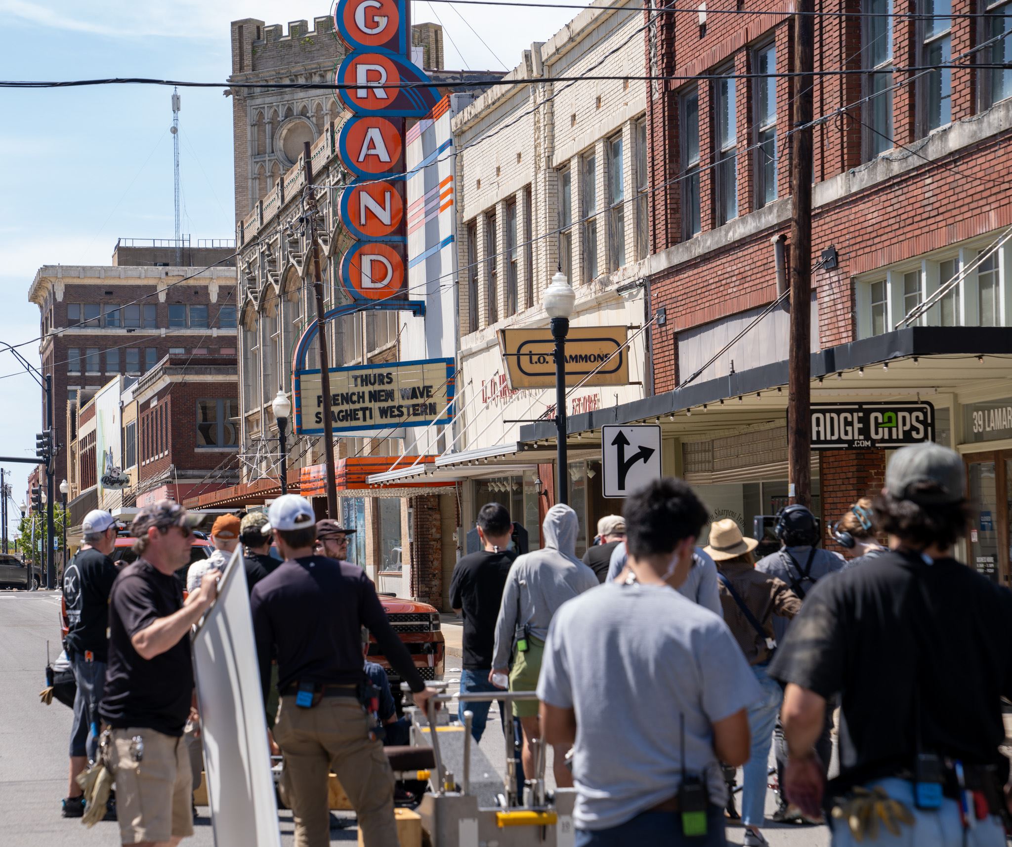 Film crew on Lamar Avenue with Grand Theater sign in background Paris Texas