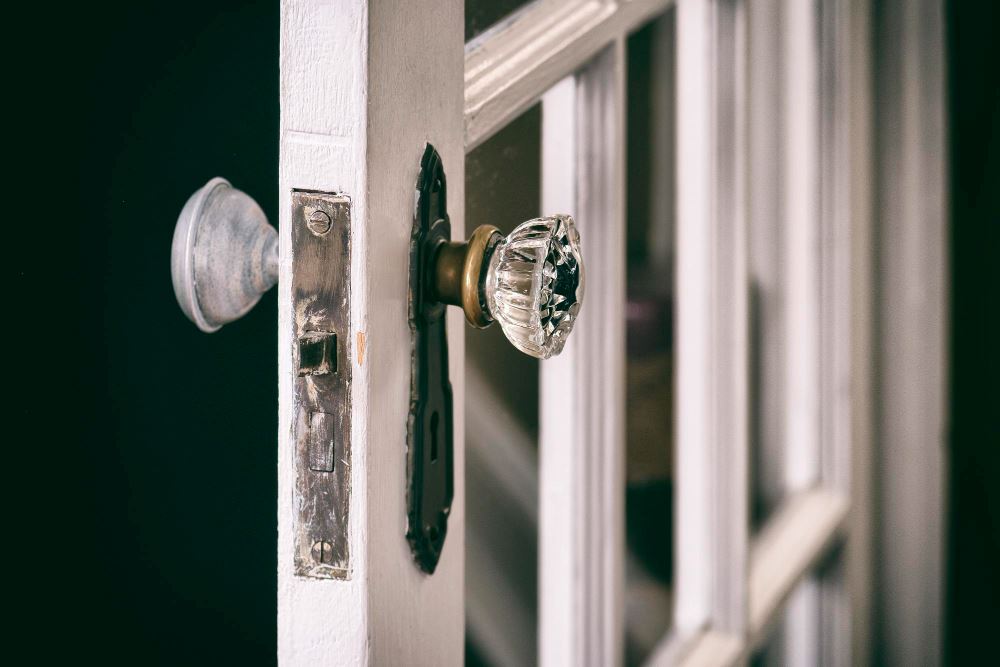 photo of an old doorknob on an old door